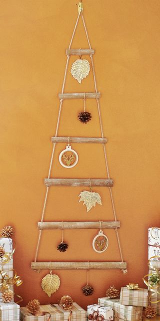 orange wall with tree ladder and gold leaf