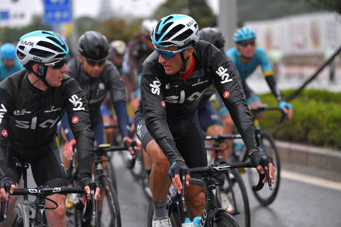 Gianni Moscon's leader's jersey is covered up by his rain gear