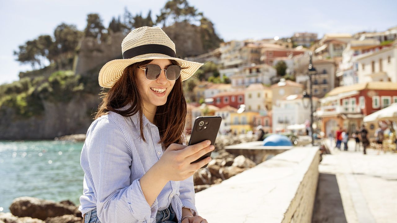 Woman on phone in sunshine