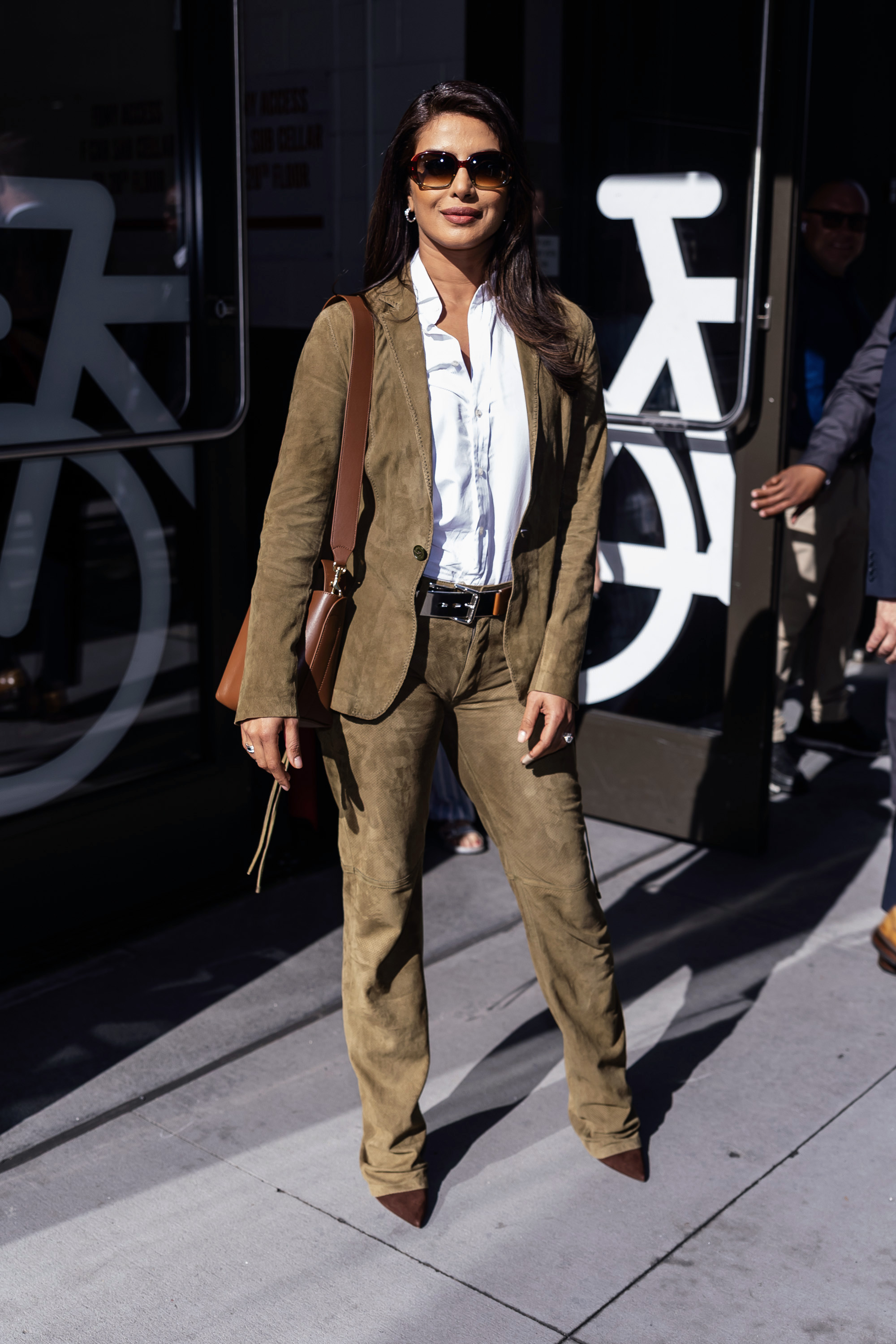 priyanka chopra wearing bootcut jeans with pointed-toe boots and a matching set