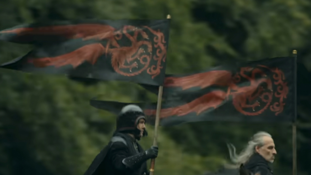 Two men riding horses and carrying Targaryan banners in A Knight of the Seven Kingdoms