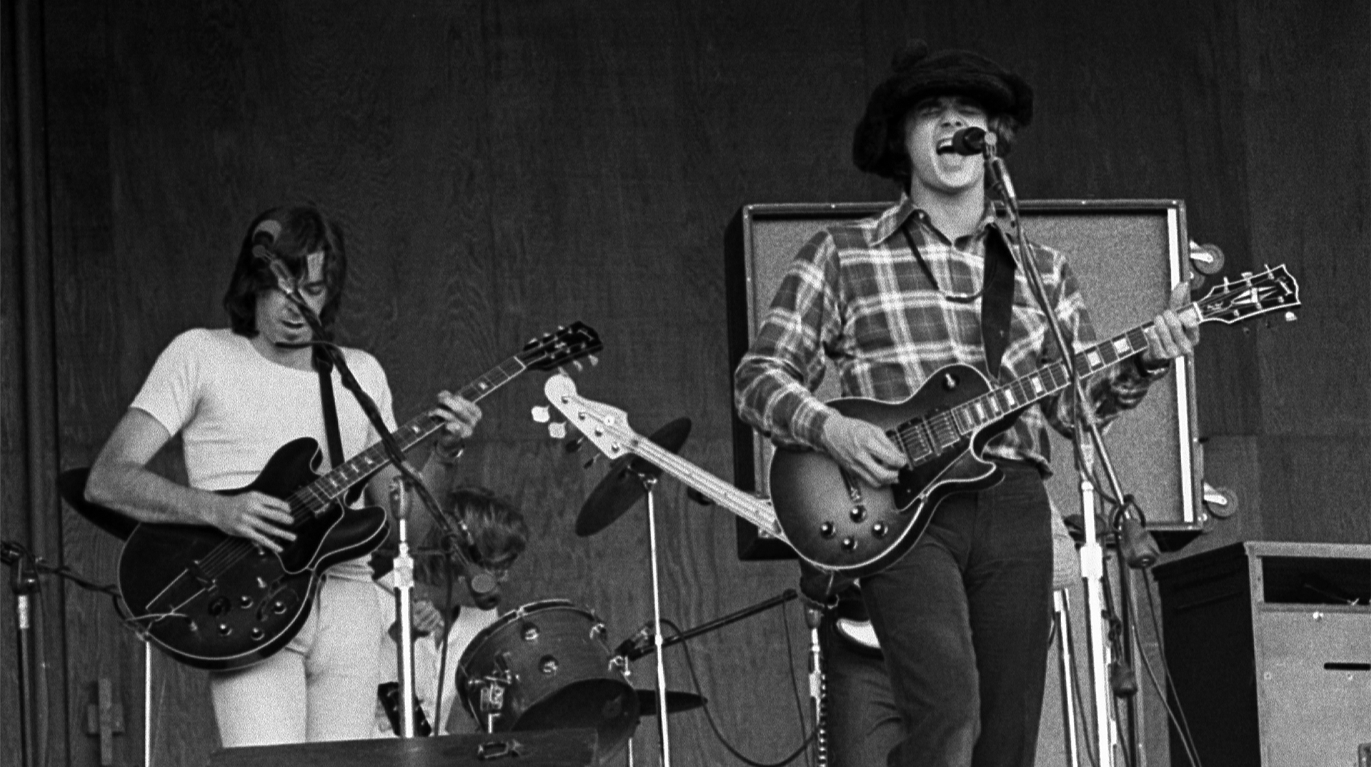 American Rock musician Steve Miller (right), on guitar, leads his band during a performance, Monterey, California, late 1960s. With him are, from left, Boz Scaggs, on guitar, and Tim Davis, on drums.