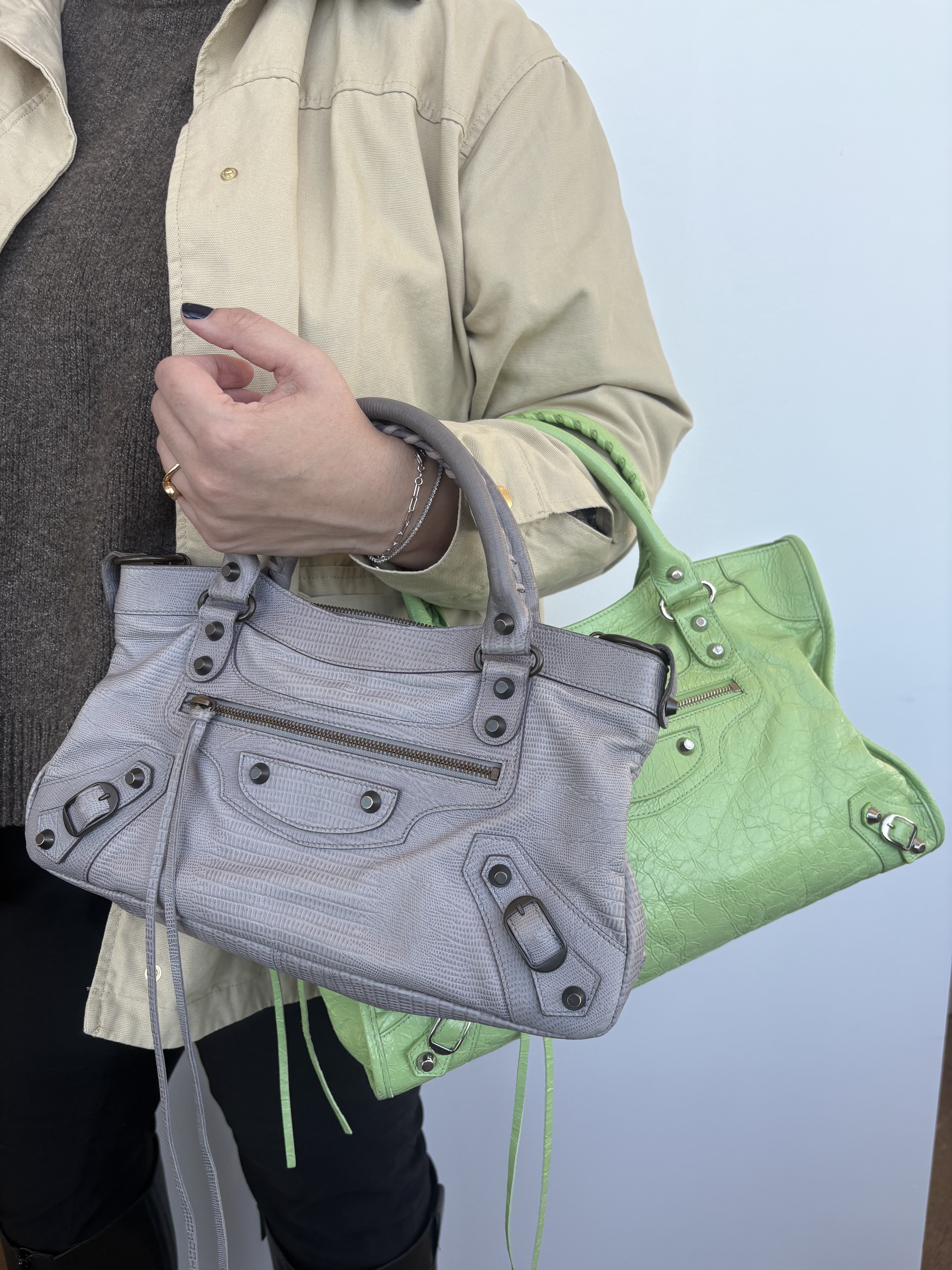 Who What Wear editor Ana Escalante holding up the Balenciaga city bag.