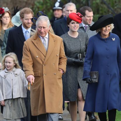 King Charles, Queen Camilla, Princess Eugenie, Peter Philips, Princess Beatrice wearing coats walking to church on Christmas