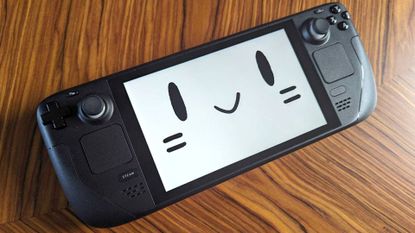 Steam Deck with mascot smiley face on screen