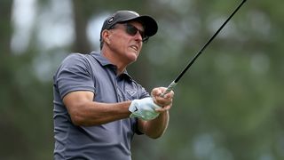 Phil Mickelson takes a shot during the first round of The Masters