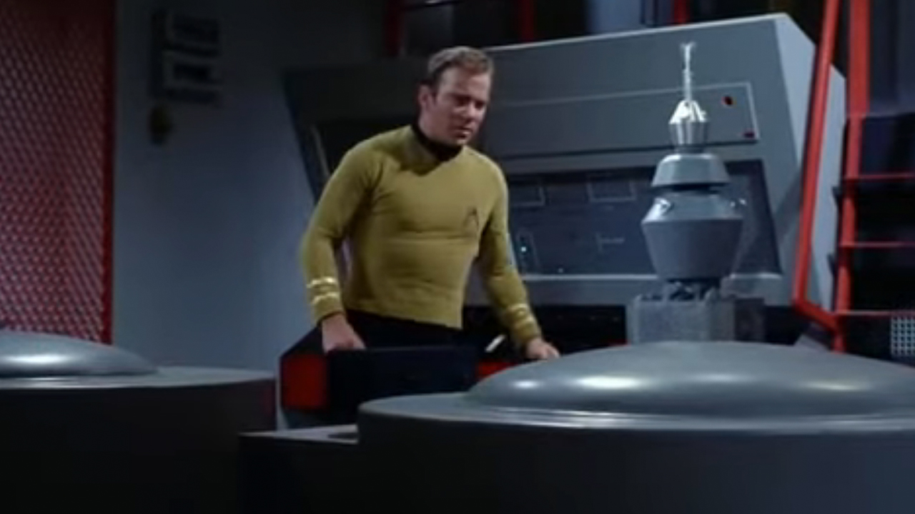 William Shatner looking at a computer in Star Trek