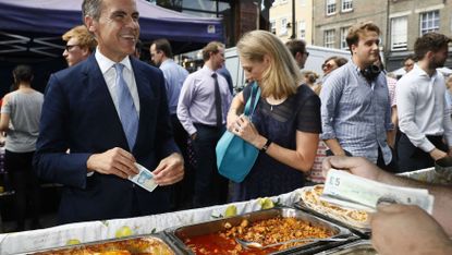 Mark Carney, Governor of the Bank of England, tries out the new £5 note
