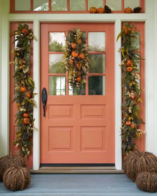 front porch decorated with fall garlands