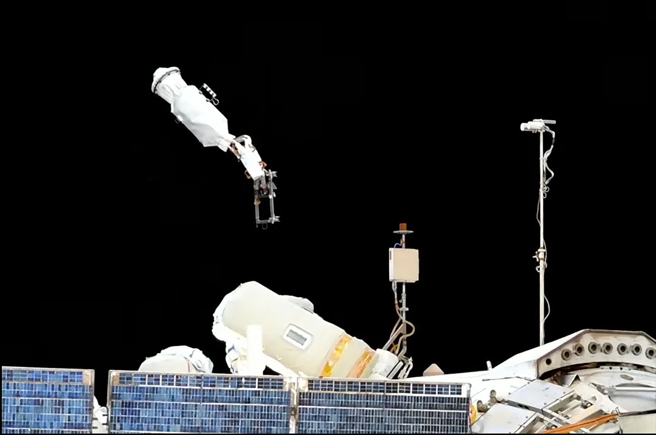 An outdated communications device is seen floating away from the International Space Station after it was jettisoned by Russian cosmonauts Sergey Prokopyev and Dmitry Petelin during a spacewalk on June 22, 2023.