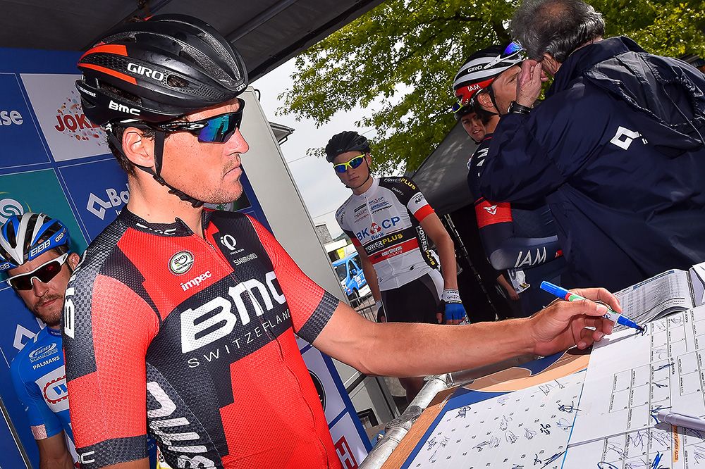 Greg Van Avermaet signs in before the final stage in Belgium.