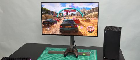 A Philips Momentum 279M1RV on a desk next to an Xbox