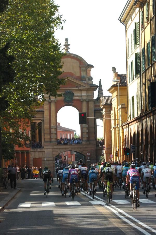 Fans watch the peloton pass in the Giro dell'Emilia