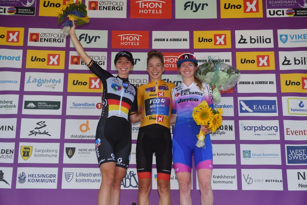 HALDEN NORWAY AUGUST 14 LR Liane Lippert of Germany and Team DSM on second place race winner Cecilie Uttrup Ludwig of Denmark and Team FDJ Nouvelle Aquitaine Futuroscope Yellow Leader Jersey and Alexandra Manly of Australia and Team BikeExchange Jayco on third place pose on the podium ceremony after the 8th Tour of Scandinavia 2022 Battle Of The North Stage 6 a 1543km stage from Lillestrm to Halden UCIWWT tourofscandinavia TOSC22 on August 14 2022 in Halden Norway Photo by Luc ClaessenGetty Images