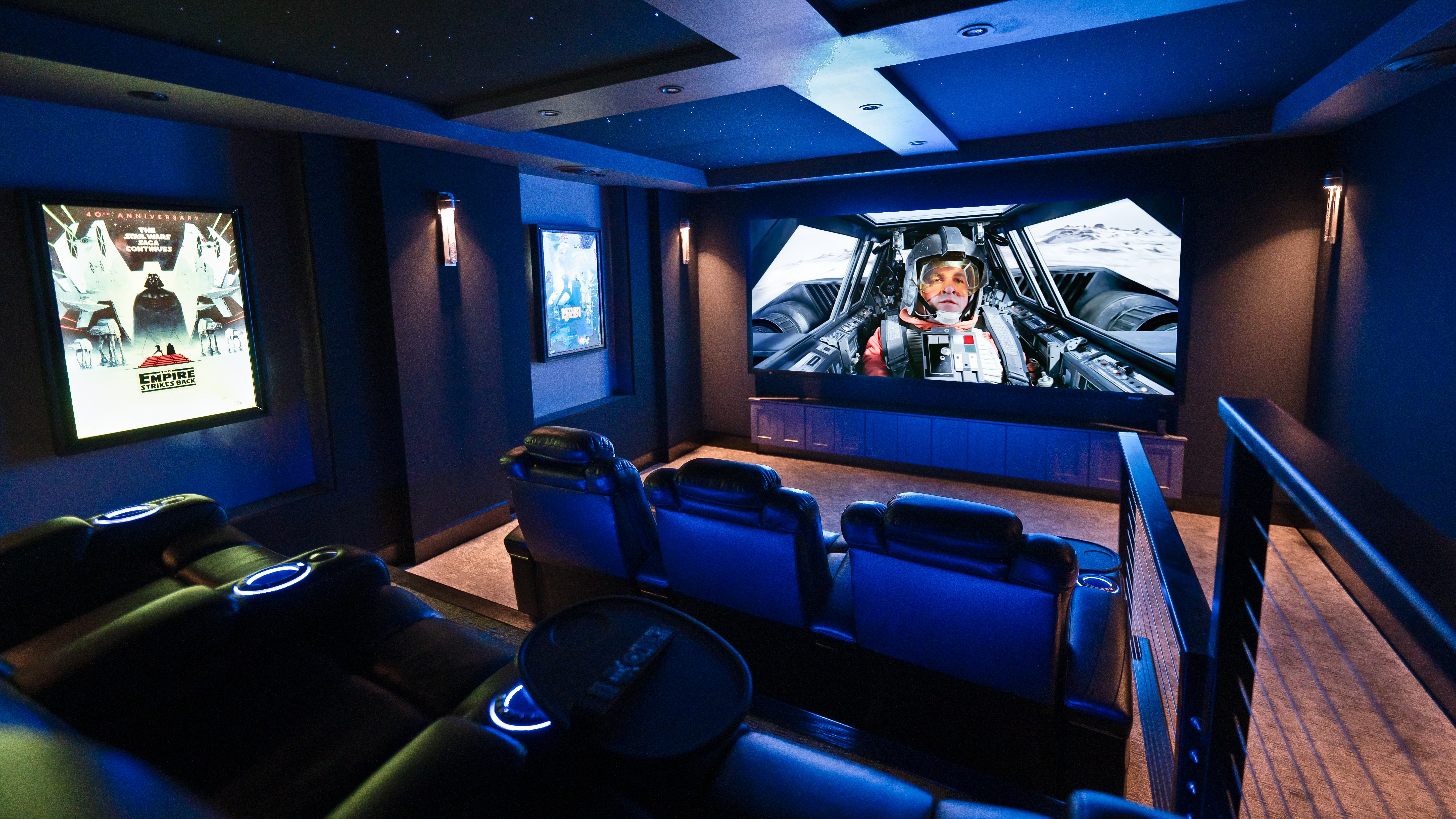 Basement Buildout Magic home theater showing seats, lighting and screen