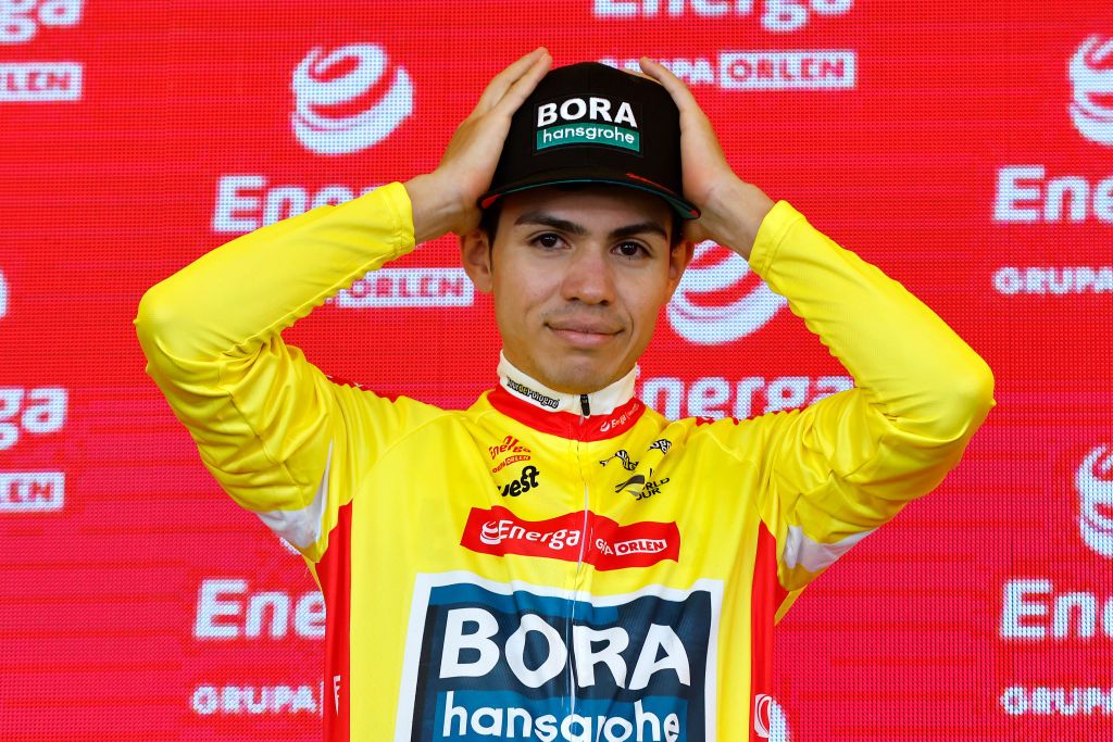 PRZEMYSL POLAND AUGUST 01 Sergio Andres Higuita Garcia of Colombia and Team Bora Hansgrohe celebrates at podium as Yellow Leader Jersey winner during the 79th Tour de Pologne 2022 Stage 3 a 2379km stage from Kranik to Przemyl TdP22 WorldTour on August 01 2022 in Przemysl Poland Photo by Bas CzerwinskiGetty Images