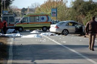 The scene of the accident in southern Italy where eight cyclists on a training ride were killed by a motorist.