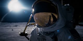 Ryan Gosling as Neil Armstrong on the moon in his astronaut suit in First Man