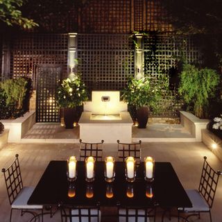 dining in garden area with garden lighting