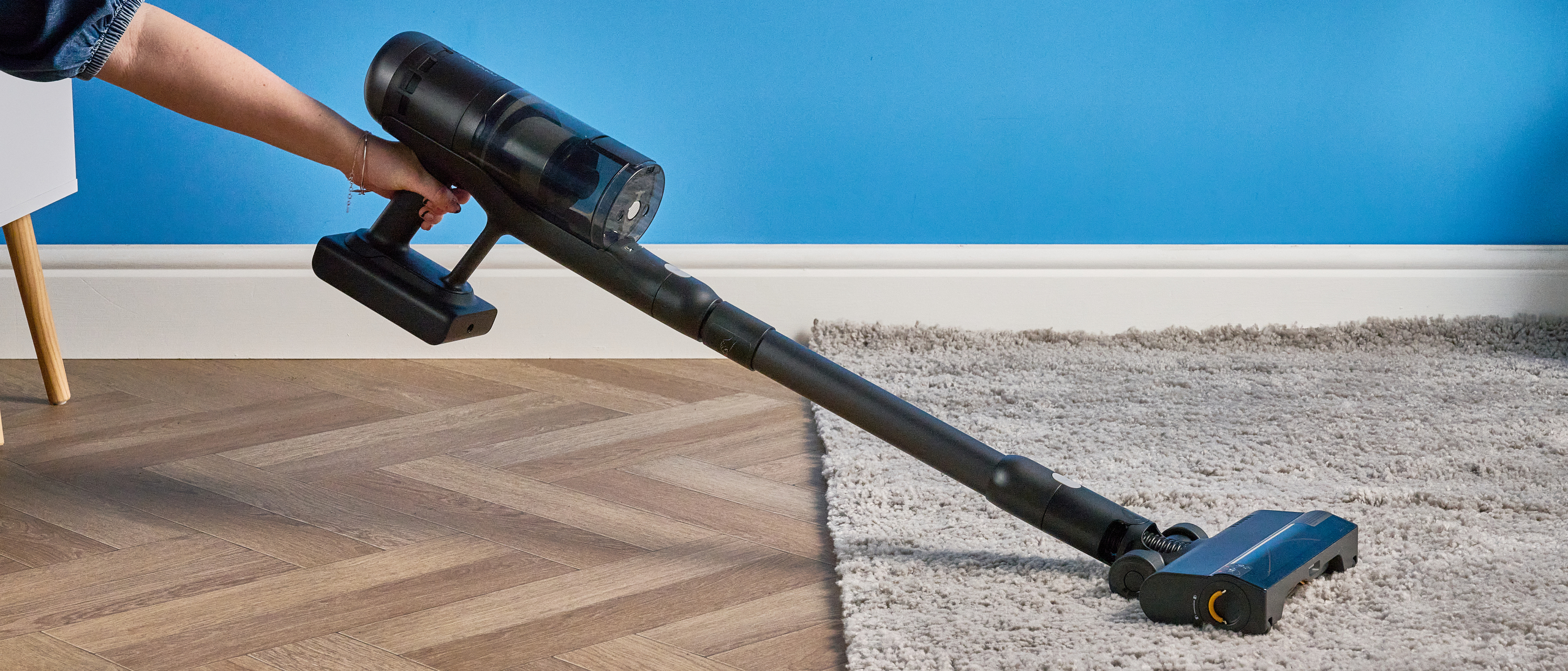 Roborock H60 Hub Ultra photograped in front f a blue background