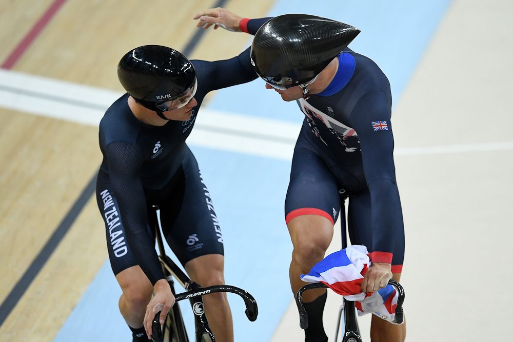 Edward Dawkins of New Zealand congratules Philip Hindes of Great Britain after Team GB wins gold and get an Olympic record in the Men's Team Sprint