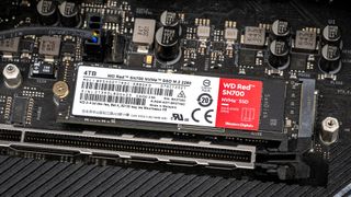 A Western Digital WD Red SN700 SSD in place on a PC motherboard