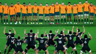 The New Zealand rugby union team perform the haka before an international against Australia, who line up facing the All Blacks