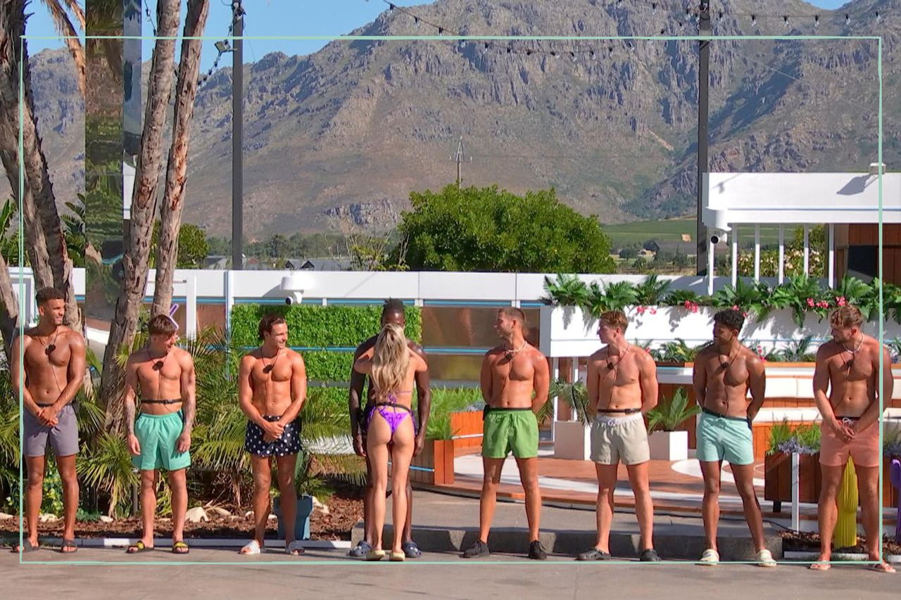 a close up of the male Love Island 2023 contestants including Will Young and Shaq Muhammad lining up in the villa