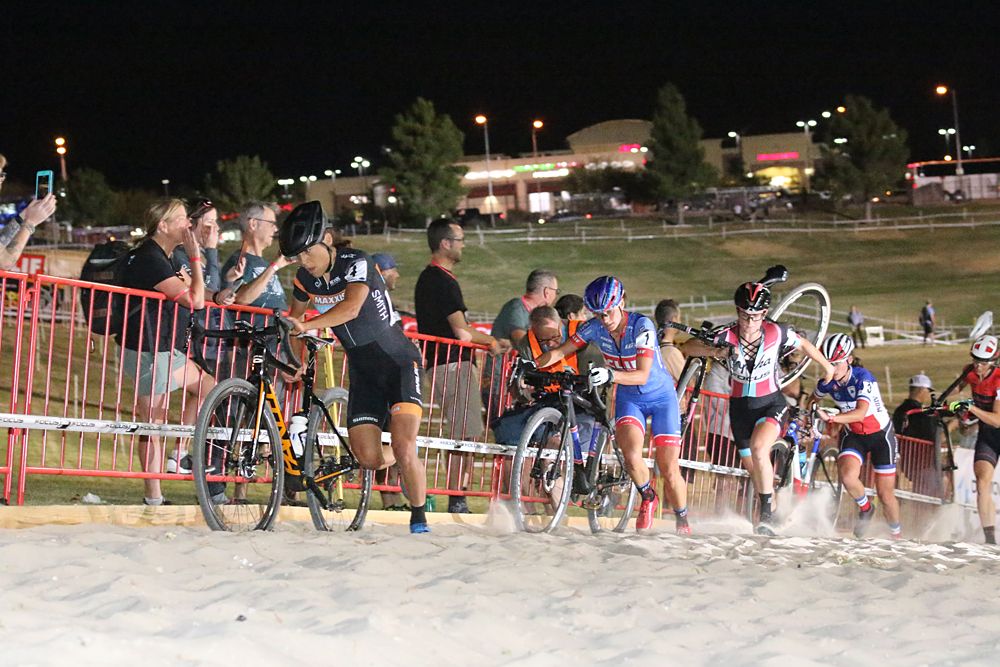 The women hit the sand pit