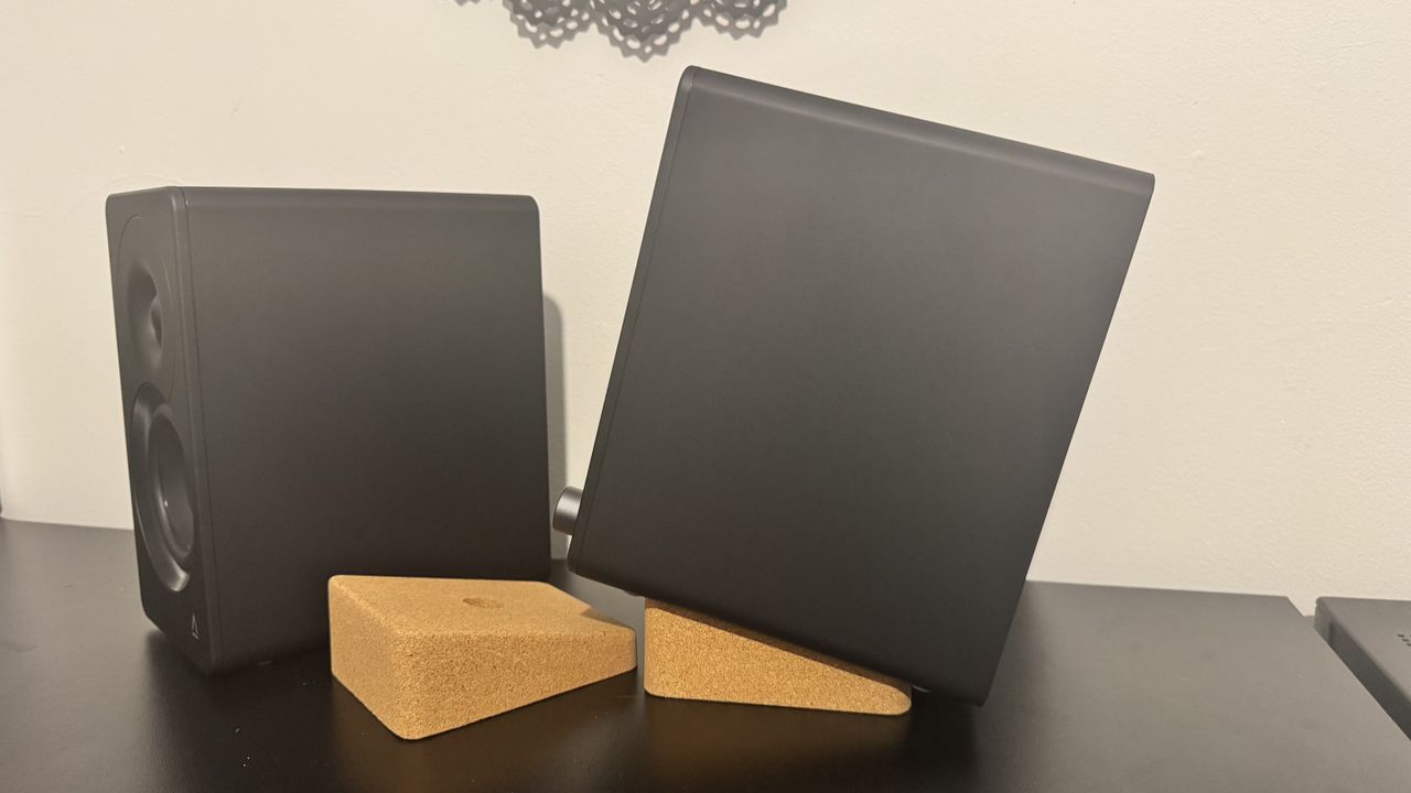 Creative XF1 speakers on a black desk