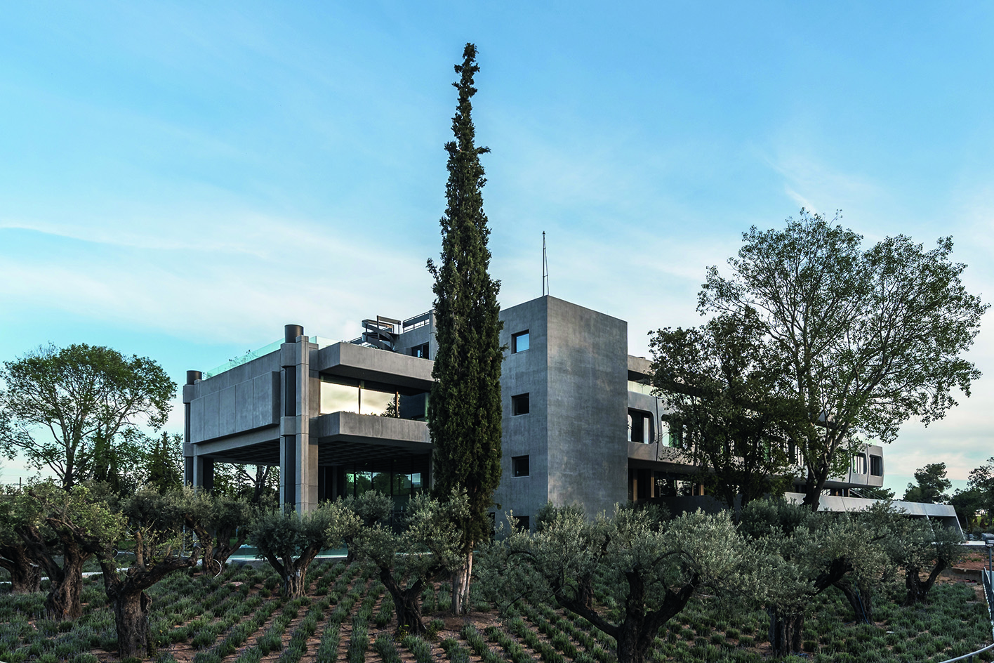 Greek brutalist gem AGET Iraklis by Alexandros Tombazis redesigned by Georges Batzios, clean concrete and marble and stone surfaces and shapes