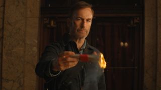 Hutch Mansell (Bob Odenkirk) burns cash in Nobody 2
