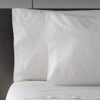 Vera Wang Percale Sheet Set on a bed.