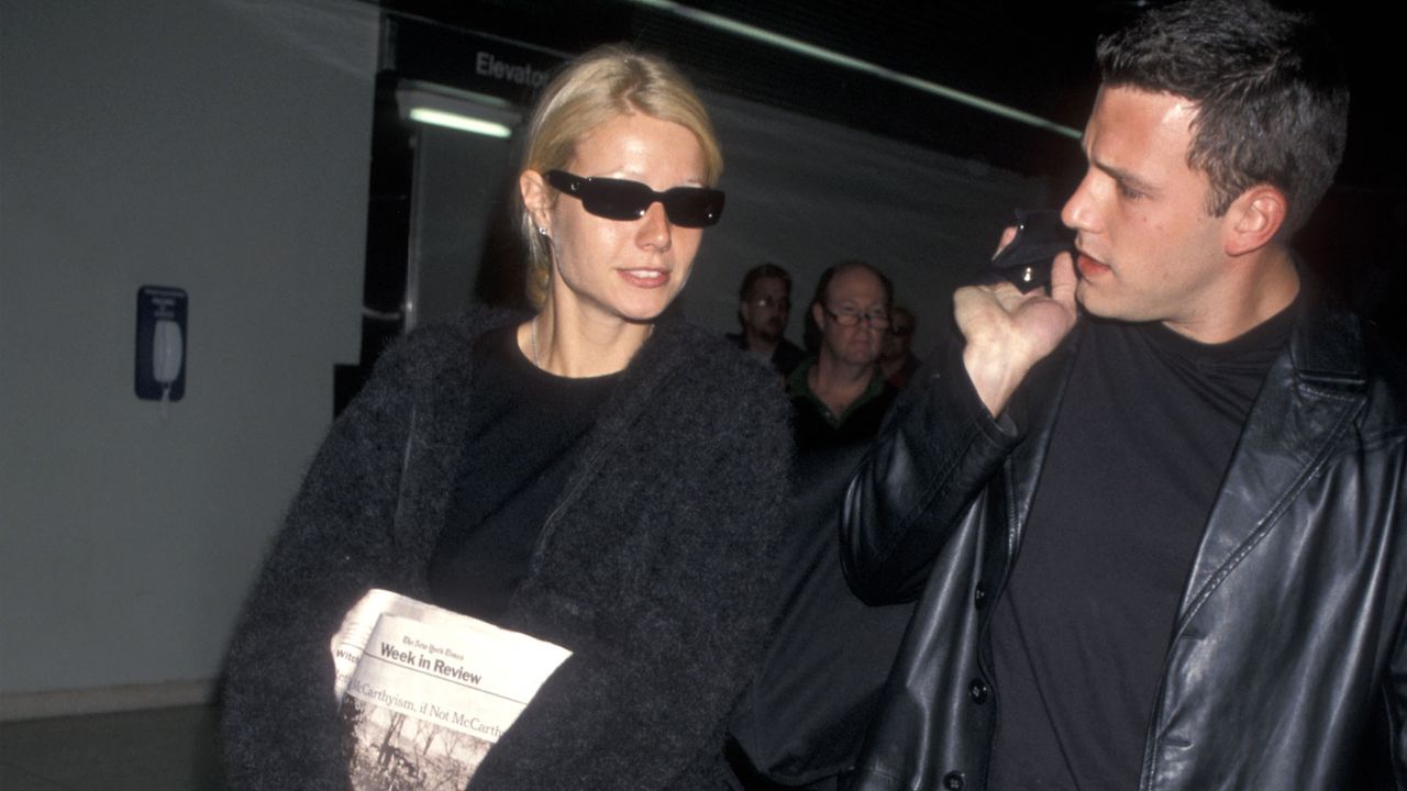 Gwyneth Paltrow carrying a Kate Spade Sam Bag in 1998 with Ben Affleck