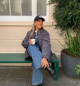 Quilted jacket with jeans and black cowboy boots outfit