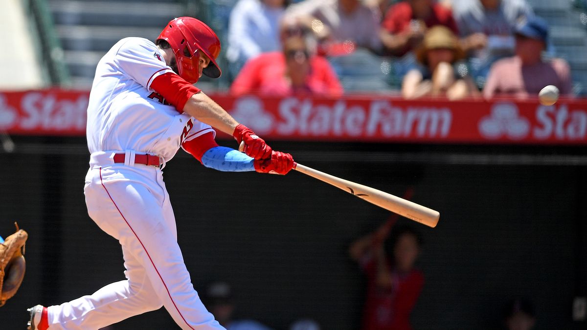 Jared Walsh #20 of the Los Angeles Angels hits a solo home run in the fourth inning of the game against the Detroit Tigers at Angel Stadium of Anaheim on June 20, 2021 in Anaheim, California.