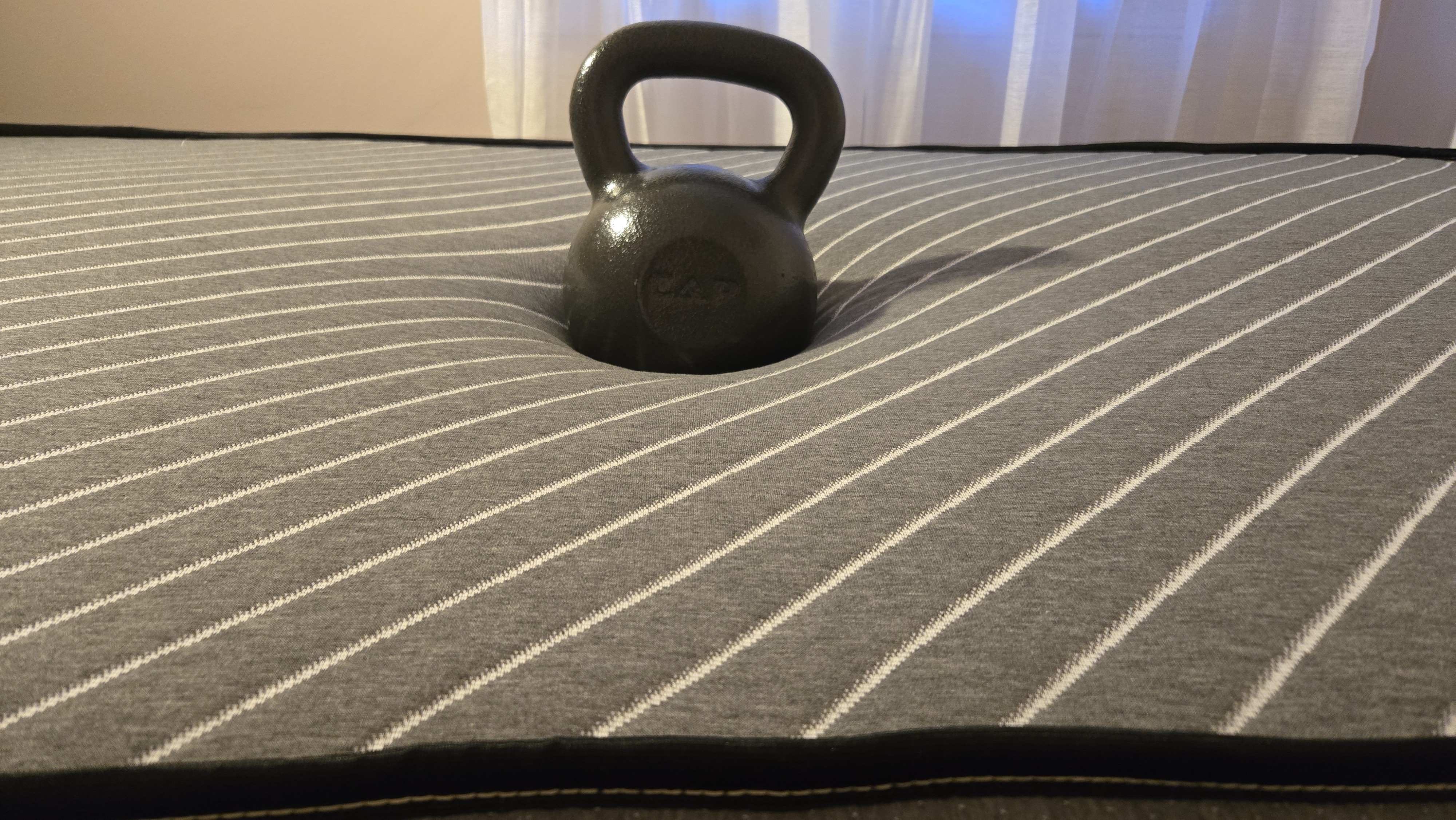 Siena Premier Hybrid Mattress review objective pressure relief test using a 50lb kettlebell to measure the sinkage