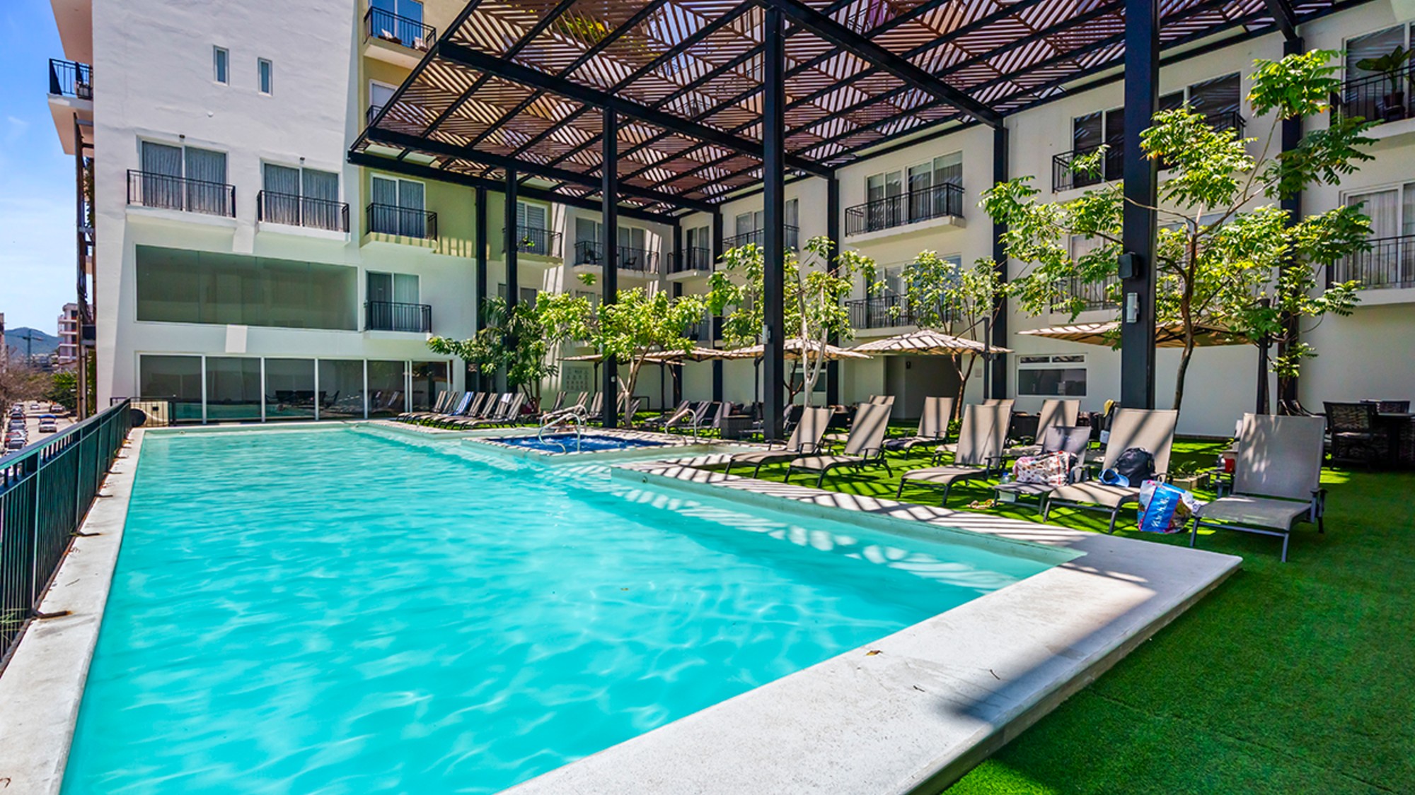 A block from Playa Bucerias on Banderas Bay about 13 miles from Puerto Vallarta, this furnished two-bedroom condo can be closed or opened into one or two units.