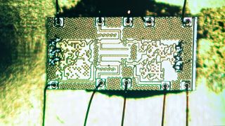 An enlarged image of the chip’s circuitry shows unusual patterns.