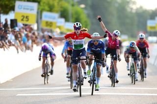 Hungarian champion Kata Blanka Vas celebrates on stage one of the Tour de Suisse, as Demi Vollering punches the air behind