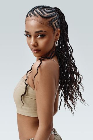 Tyla wears a linen crop top, linen pants, and chain belt in a Gap spring 2024 campaign
