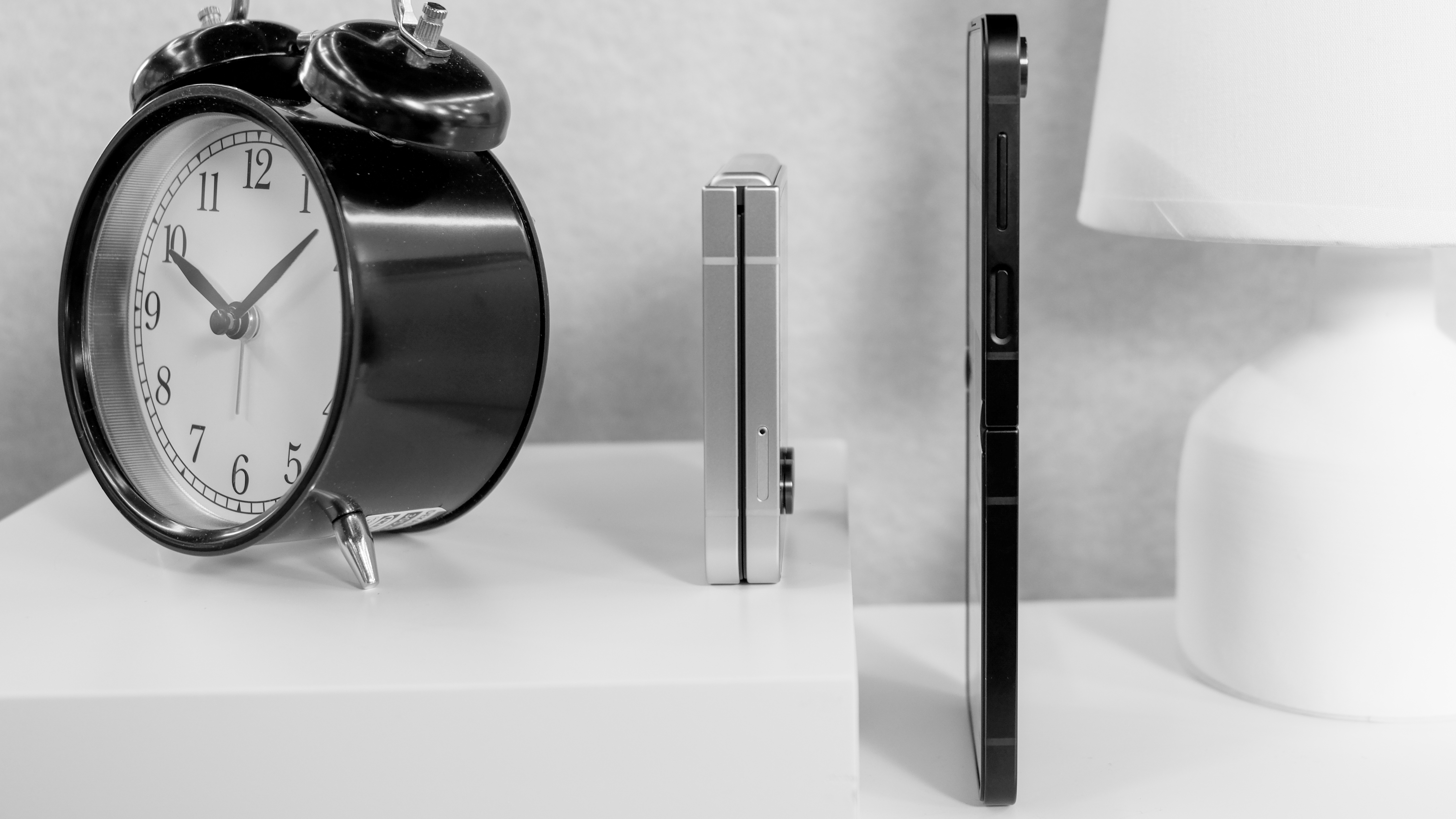 Two Samsung Galaxy Z Flip 7 FE devices open and closed both shown from the side