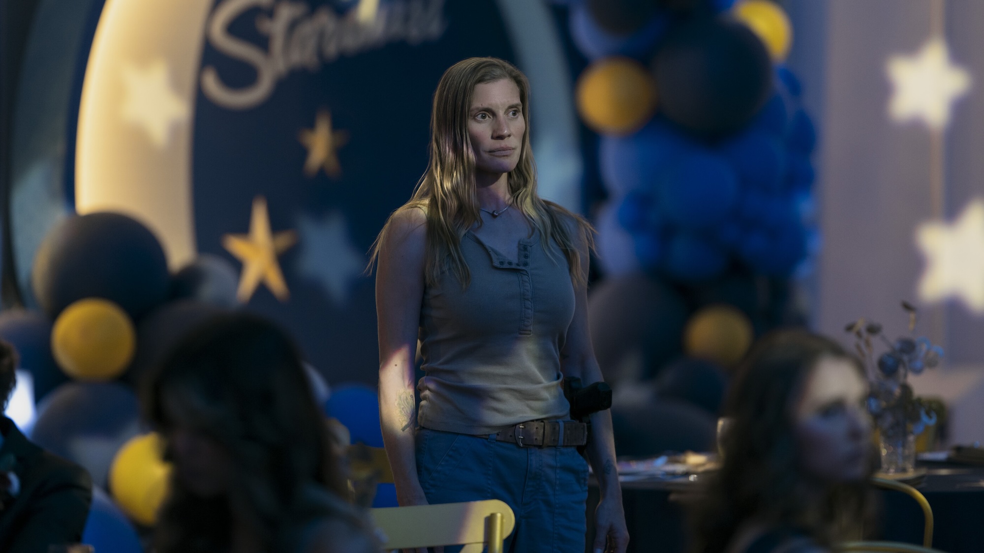 Katee Sackhoff standing in the gym at the prom in Carrie