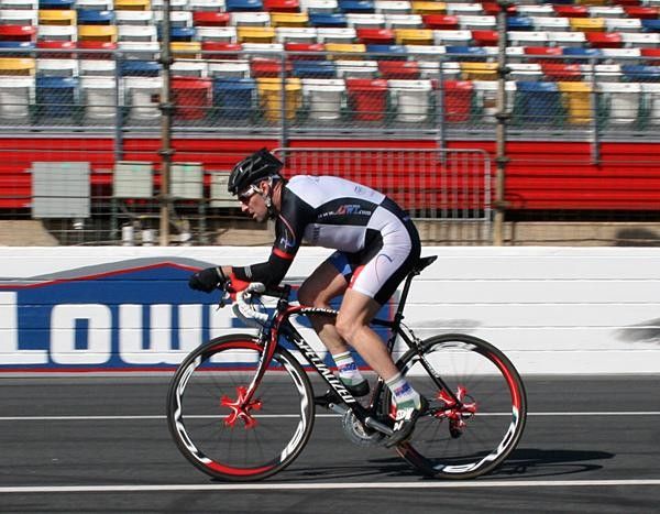 Nathan rides the Tarmac road bike on the clip-ons with road helmet.