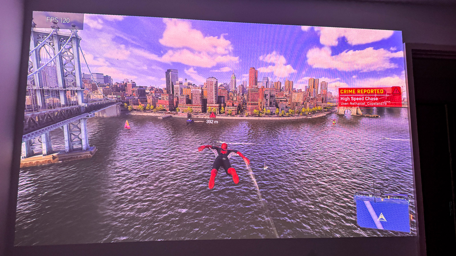 Spider-Man 2 PS5 game being projected onto a wall