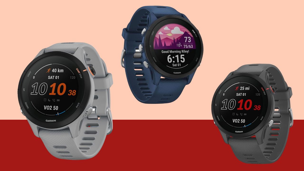 Three Garmin Forerunner 255 fitness watches on a pink and red background