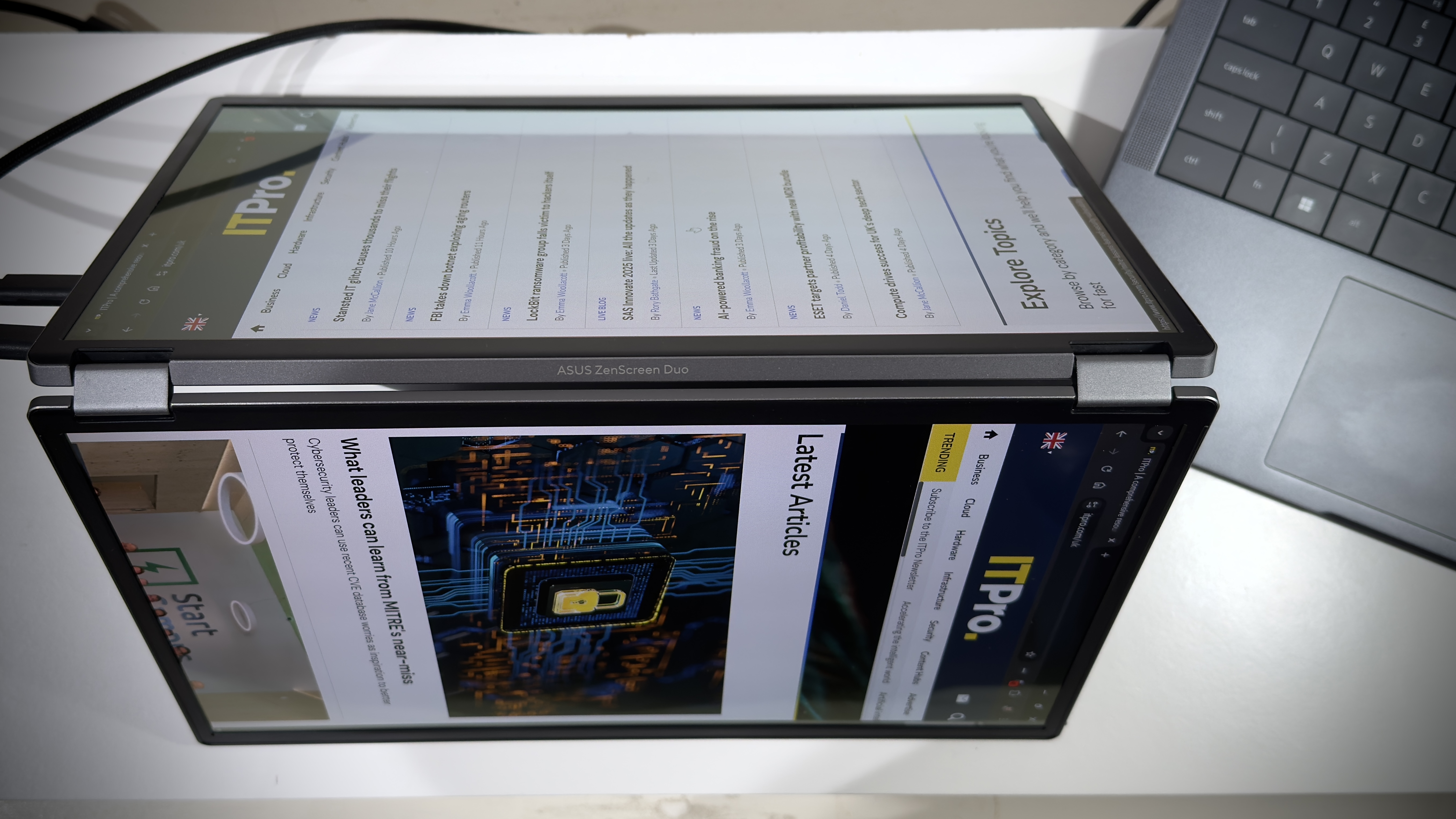 The Asus ZenScreen Duo MQ149CD on a desk