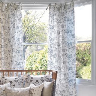 room with curtains and dressing large bay windows