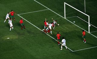 Angelos Charisteas of Greece scores their winning goal during the UEFA Euro 2004 Final match between Portugal and Greece at the Luz Stadium on July 4, 2004 in Lisbon, Portugal. Greece defeated Portugal 1-0. (Photo by Shaun Botterill/Getty Images)