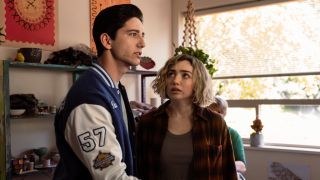 L-R: Milo Manheim as Wally Clark looking forward and interested and Peyton List as Maddie Nears looking up at him in School Spirits